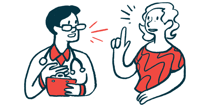 A person in a red shirt talks with a clinician in a white coat and glasses.