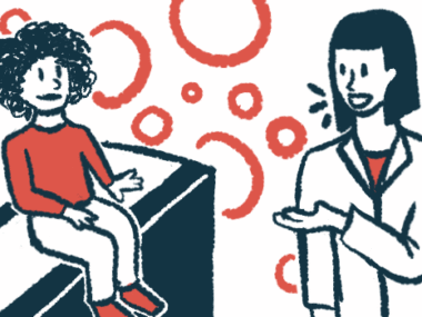 A child in a red shirt sits on an exam table and listens to a doctor in a white coat.