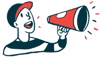 A person in a baseball cap speaks using a megaphone.