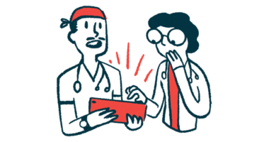 Two doctors react with surprise while looking at a tablet.